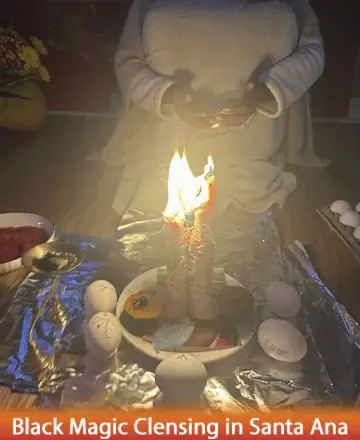 In a serene setting filled with gentle warmth, a nurturing presence tends to flickering candles surrounded by sacred symbols. This peaceful ritual invites tranquility and healing, embracing the soul with its soft glow and comforting energy. Black magic cleansing in Santa Ana.