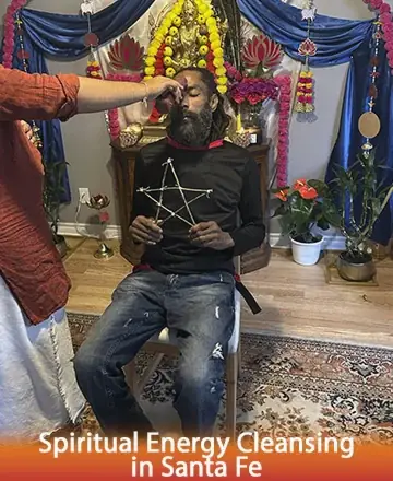 In a serene sanctuary adorned with vibrant flowers and sacred symbols, a gentle ritual unfolds. A serene figure sits in peaceful meditation, embraced by a nurturing presence. This moment whispers of healing and renewal, offering tranquility to the soul. Spiritual energy cleansing in Santa Fe.