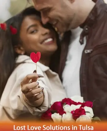 In this heartwarming image, a couple shares a tender moment filled with joy and affection, surrounded by the vibrant colors of red and white roses. Their smiles reflect a deep connection, symbolizing love's enduring power to heal and unite. Lost love solutions in Tulsa.