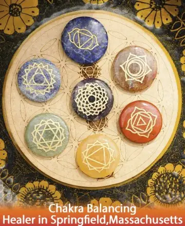 This serene image captures the essence of harmony and balance, with vibrant chakra stones meticulously arranged to invite peace and clarity into your life. Each stone resonates with a gentle energy, guiding you toward inner tranquility and spiritual alignment. Chakra balancing healer in Springfield, Massachusetts.