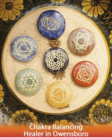 This serene image captures a harmonious arrangement of chakra stones, each radiating its own gentle energy. The intricate symbols evoke a sense of balance and tranquility, inviting you to embrace inner peace and spiritual alignment. Chakra balancing healer in Owensboro.