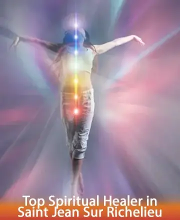 A person stands with arms outstretched, surrounded by vibrant, multicolored light rays symbolizing chakras. The background is a soft, ethereal blend of blues, pinks, and purples. Text reads 