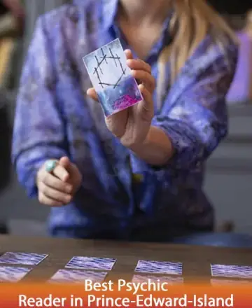 In a serene moment of connection, a gentle hand offers insight through a beautifully illustrated card, inviting reflection and calm. The soothing hues and focused energy create a space of trust and understanding. Tarot reading in Prince Edward Island.