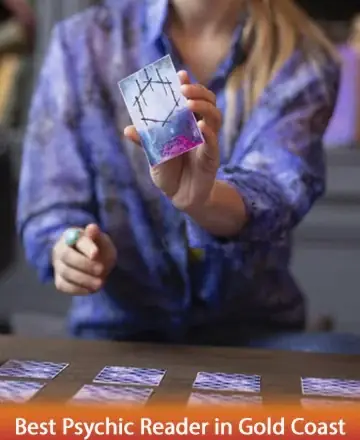 A gentle hand reveals a beautifully illustrated card, inviting you into a world of introspection and peace. Bathed in calming hues, the setting whispers tranquility and wisdom, offering guidance and comfort. Tarot reading in Gold Coast.