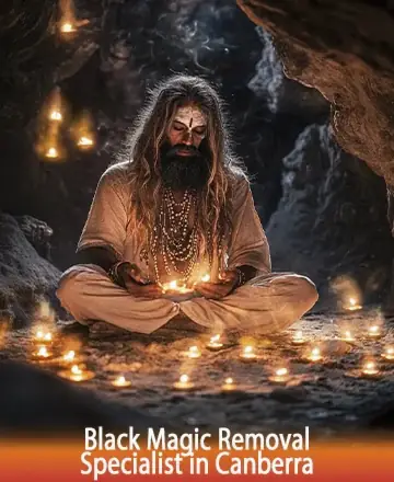 In a serene cave, bathed in the gentle glow of countless candles, a wise figure sits in peaceful meditation. The warm light reflects a journey towards inner peace and protection, guided by ancient wisdom. Black magic removal in Canberra.