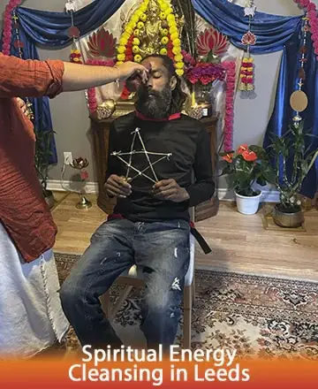 In a serene and sacred space, gentle hands perform a ritual, infusing calm and balance into the soul. The soft glow of candles and the vibrant colors of flowers create a haven of peace, nurturing the spirit and easing the mind. Spiritual energy cleansing in Leeds.