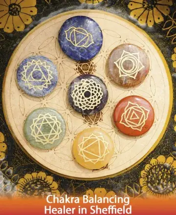 A harmonious circle of vibrant chakra stones rests on a sacred mandala, each symbol radiating serenity and balance. This gentle arrangement invites tranquility and inner peace, offering a comforting embrace for the soul. Chakra balancing healer in Sheffield.